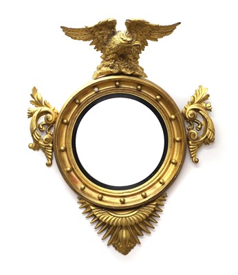 Lot 506 - A Regency giltwood convex wall mirror