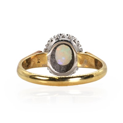 Lot 97 - An 18ct gold opal and diamond cluster ring