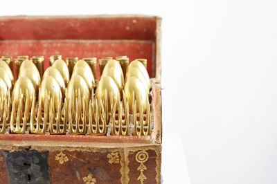 Lot 424 - A canteen of gilt copper flatware