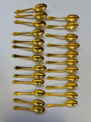 Lot 424 - A canteen of gilt copper flatware