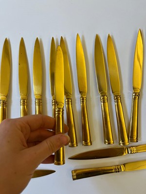 Lot 424 - A canteen of gilt copper flatware