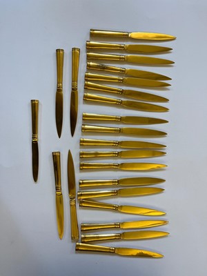 Lot 424 - A canteen of gilt copper flatware
