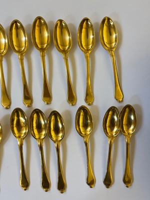 Lot 424 - A canteen of gilt copper flatware