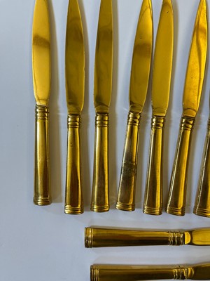 Lot 424 - A canteen of gilt copper flatware