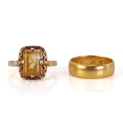 Lot 200 - A gold wedding band and a gold citrine ring