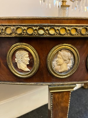 Lot 554 - A pair of neoclassical mahogany and ormolu pier tables