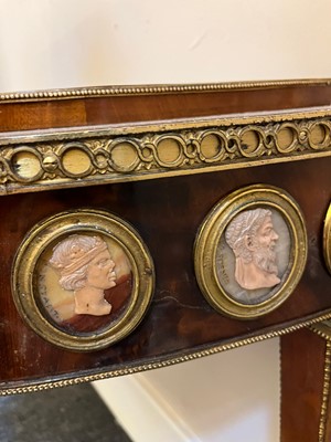 Lot 554 - A pair of neoclassical mahogany and ormolu pier tables