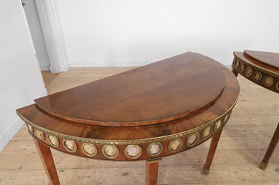 Lot 554 - A pair of neoclassical mahogany and ormolu pier tables