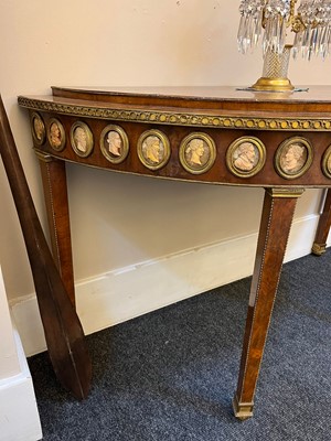 Lot 554 - A pair of neoclassical mahogany and ormolu pier tables