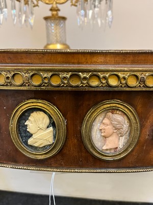 Lot 554 - A pair of neoclassical mahogany and ormolu pier tables