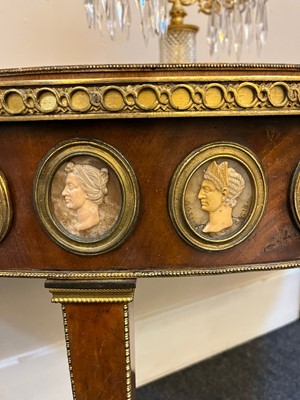 Lot 554 - A pair of neoclassical mahogany and ormolu pier tables