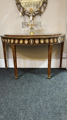 Lot 554 - A pair of neoclassical mahogany and ormolu pier tables