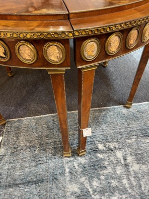 Lot 554 - A pair of neoclassical mahogany and ormolu pier tables