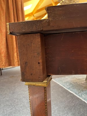 Lot 554 - A pair of neoclassical mahogany and ormolu pier tables