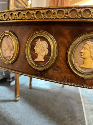 Lot 554 - A pair of neoclassical mahogany and ormolu pier tables