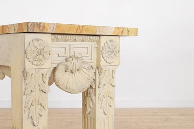 Lot A George II-style carved and painted pine console table in the manner of William Kent