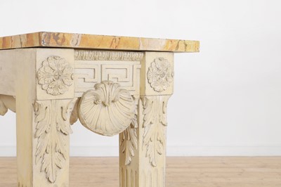 Lot 573 - A George II-style carved and painted pine console table in the manner of William Kent