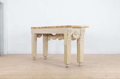 Lot A George II-style carved and painted pine console table in the manner of William Kent