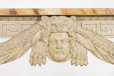 Lot 573 - A George II-style carved and painted pine console table in the manner of William Kent