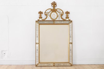 Lot 475 - A gilt-metal, giltwood and etched glass wall mirror, after the model by Burchard Precht