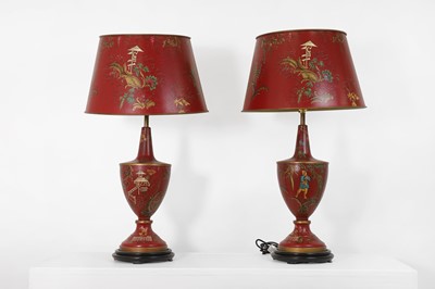 Lot 579 - A pair of toleware table lamps