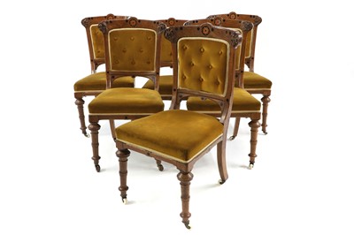 Lot 395 - A matched set of six oak and dining chairs