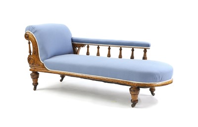 Lot 327 - An oak chaise longue