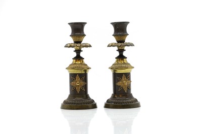 Lot 280A - A pair of Regency bronze and ormolu candlesticks