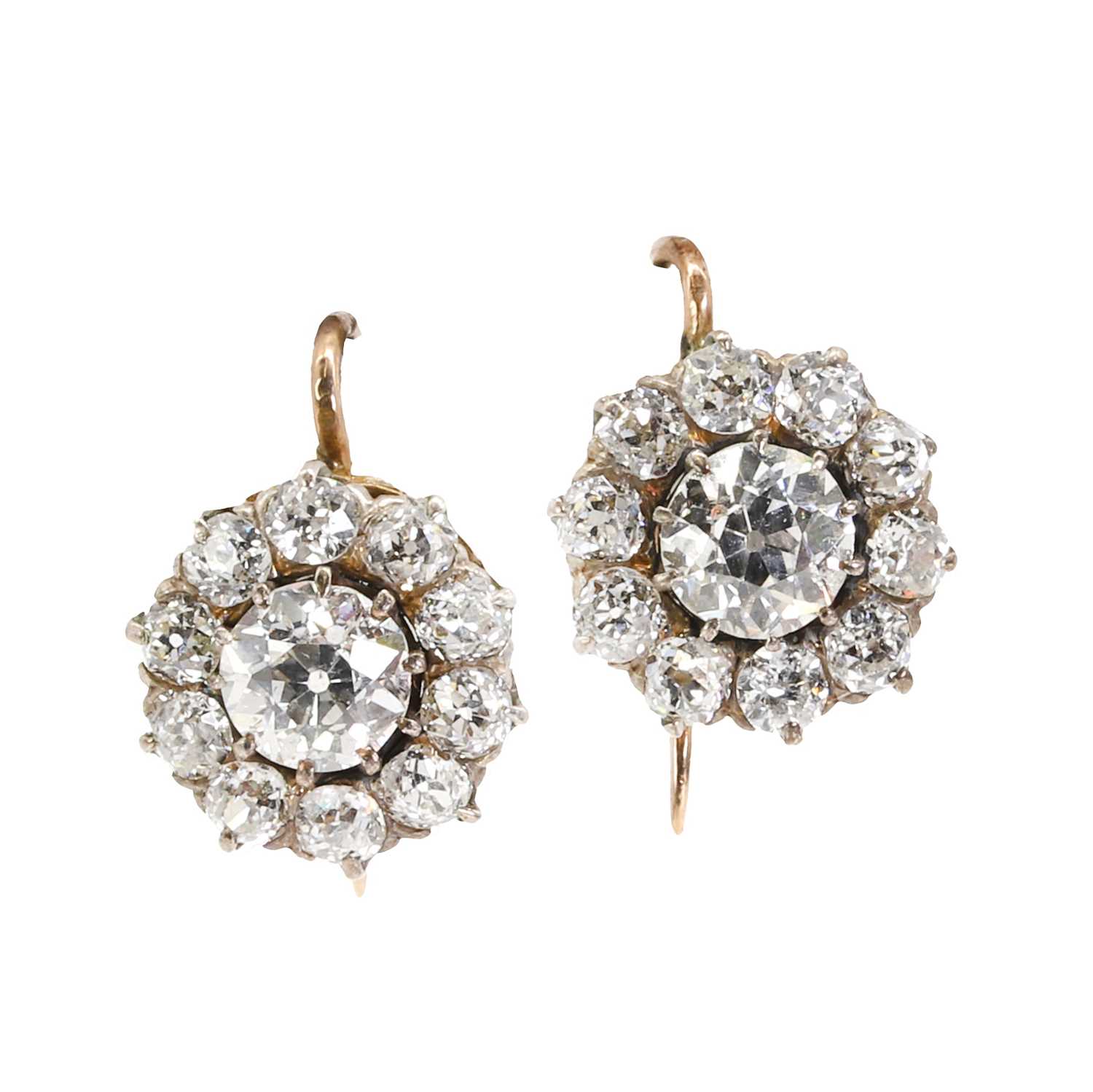 Lot 33 - A pair of  diamond daisy cluster earrings, c.1890