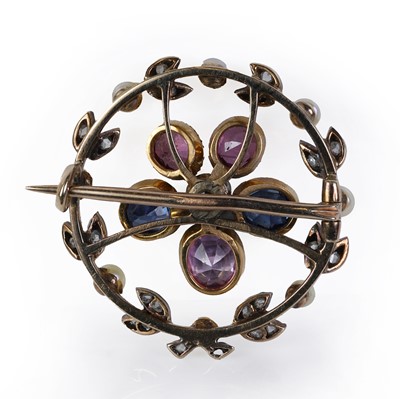 Lot 44 - A blue and pink sapphire, diamond and split pearl wreath brooch
