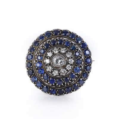 Lot 65 - A diamond and sapphire target brooch/pendant