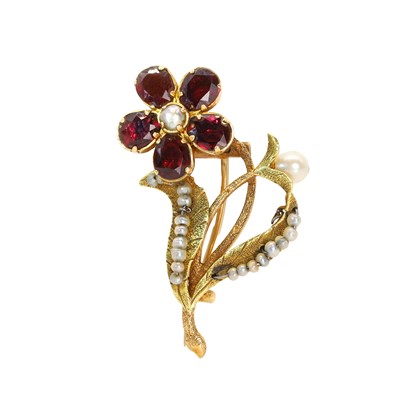 Lot 20 - A garnet and seed pearl floral brooch