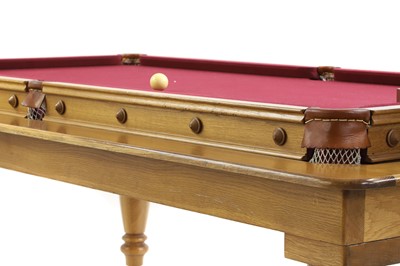 Lot 558 - A Hamilton 'Buchanan' three quarter size oak snooker or dining table