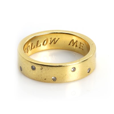 Lot 65 - An 18ct gold diamond wedding ring
