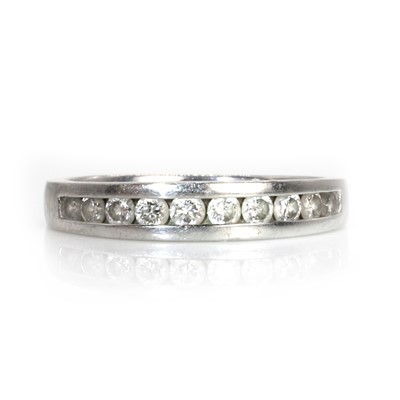 Lot 73 - A platinum diamond half eternity ring