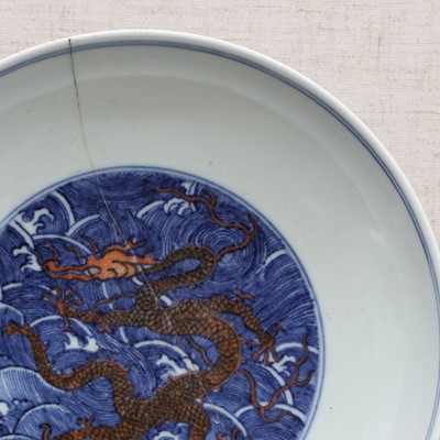Lot 85 - A Chinese underglaze-blue and copper-red dish