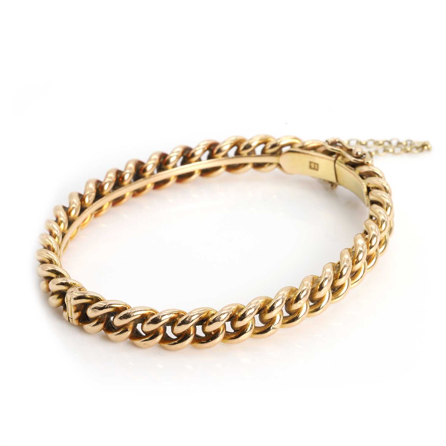 Lot 58 - A chain and hinged bangle,