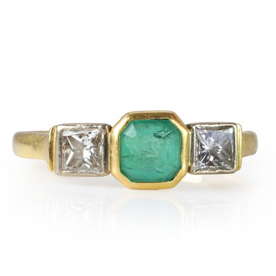 Lot 179 - An 18ct gold emerald and diamond ring