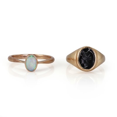 Lot 191 - A 9ct gold onyx ring and an opal ring
