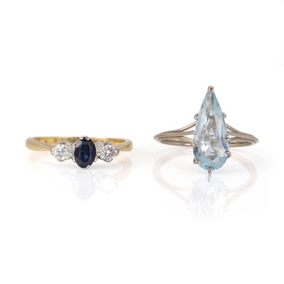 Lot 215 - A white gold aquamarine ring and a gold sapphire and diamond ring