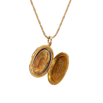 Lot 53 - An Edwardian enamel locket pendant and chain