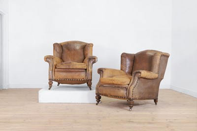 Lot 206 - A pair of walnut and leather-upholstered club armchairs