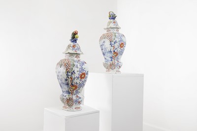 Lot 572 - A pair of delft polychrome vases