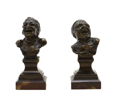 Lot 311 - A pair of bronze character busts