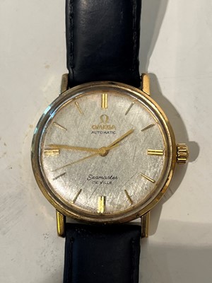 Lot 409 - A gold Omega Seamaster DeVille automatic strap watch
