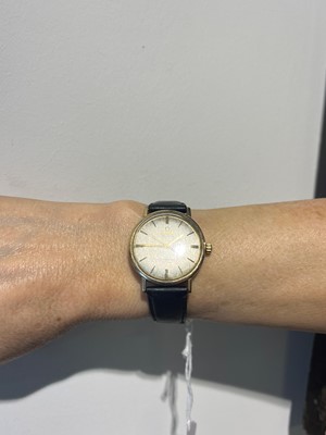 Lot 409 - A gold Omega Seamaster DeVille automatic strap watch