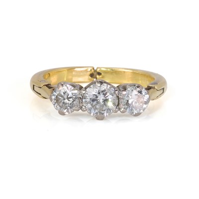 Lot 127 - A gold three stone diamond hinged shank ring