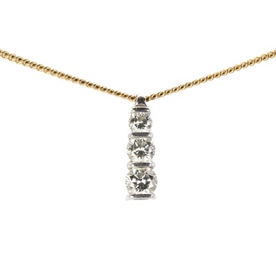 Lot 164 - An 18ct gold diamond three stone pendant and chain