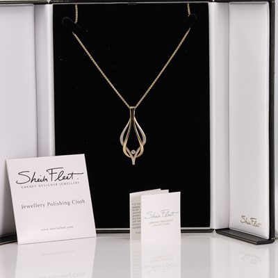 Lot 71 - A gold diamond 'Reef Knot' necklace, by Sheila Fleet