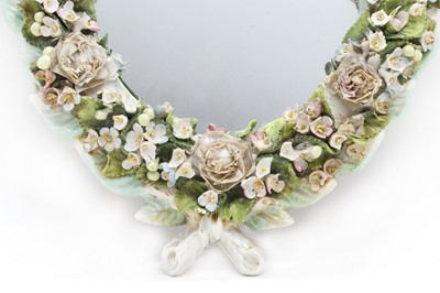 Lot 214 - A Meissen style porcelain mirror